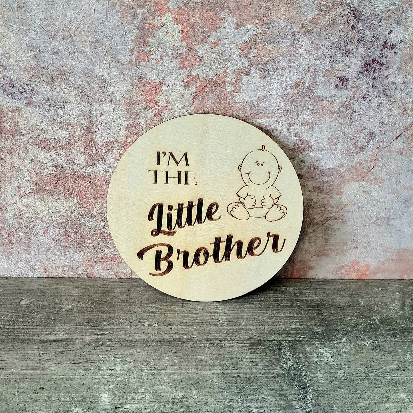 Personalised wooden sibling pregnancy announcement sign engraved with custom name