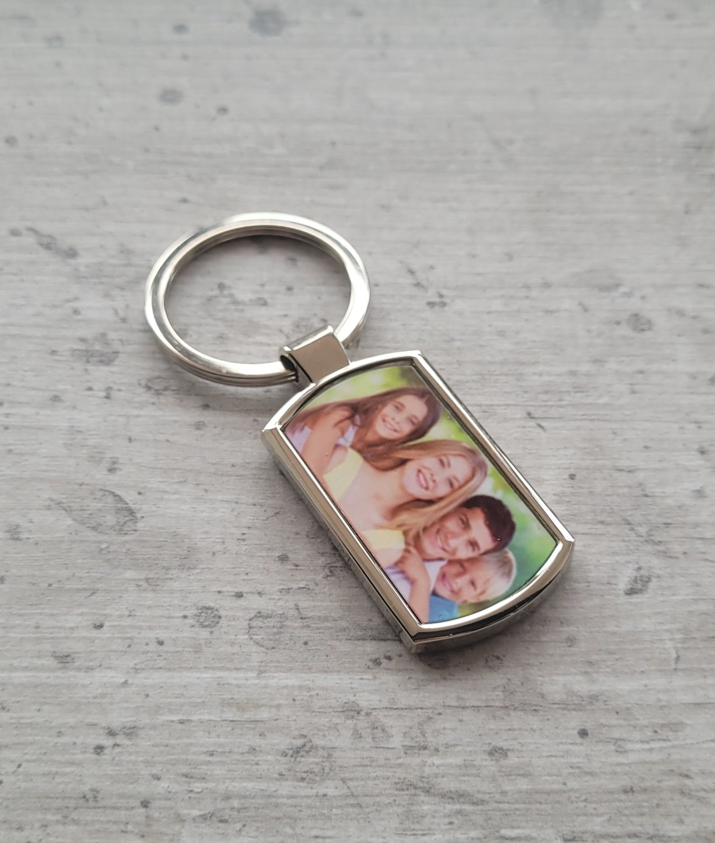 Custom rectangle photo keychain on tabletop