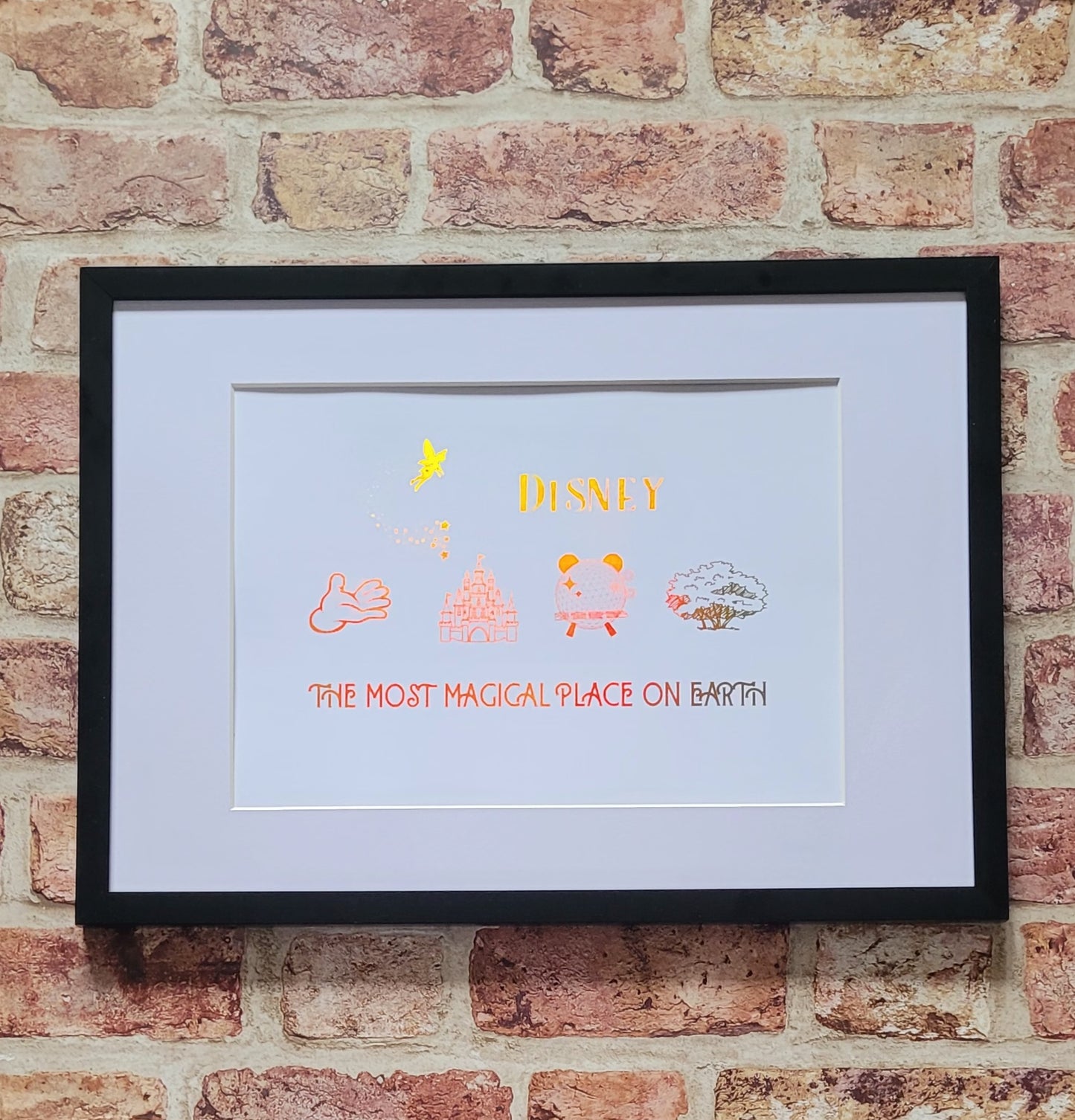 Disney-inspired family keepsake framed in white frame with shimmering foil