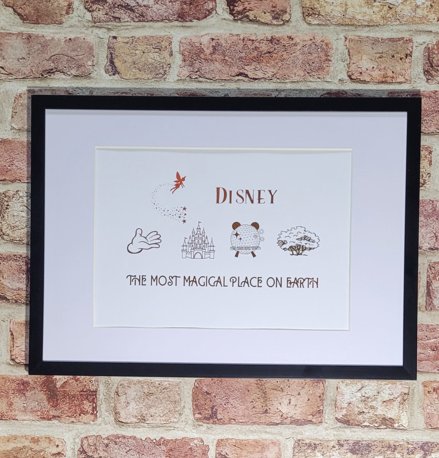 Disney-inspired family keepsake framed in white frame with shimmering rose gold foil