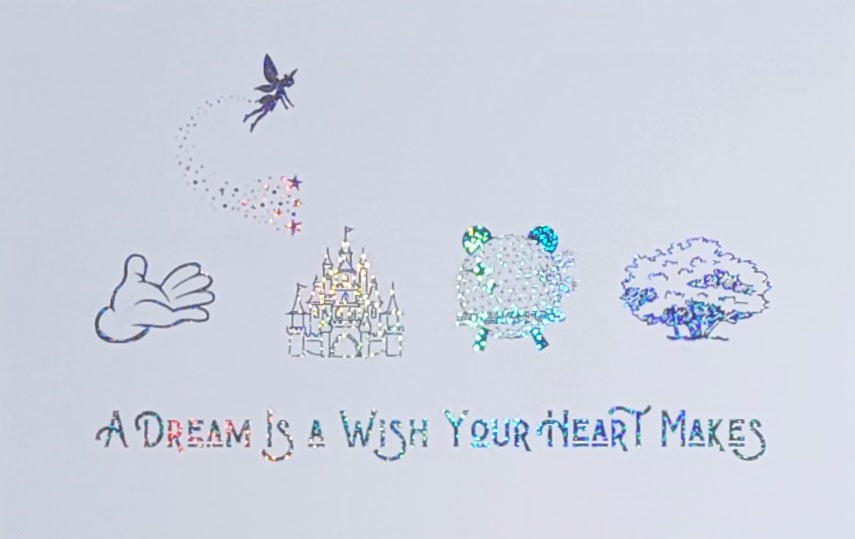 Close-up of Holographic silver coloured foil Disney-inspired artwork inside black photo frame