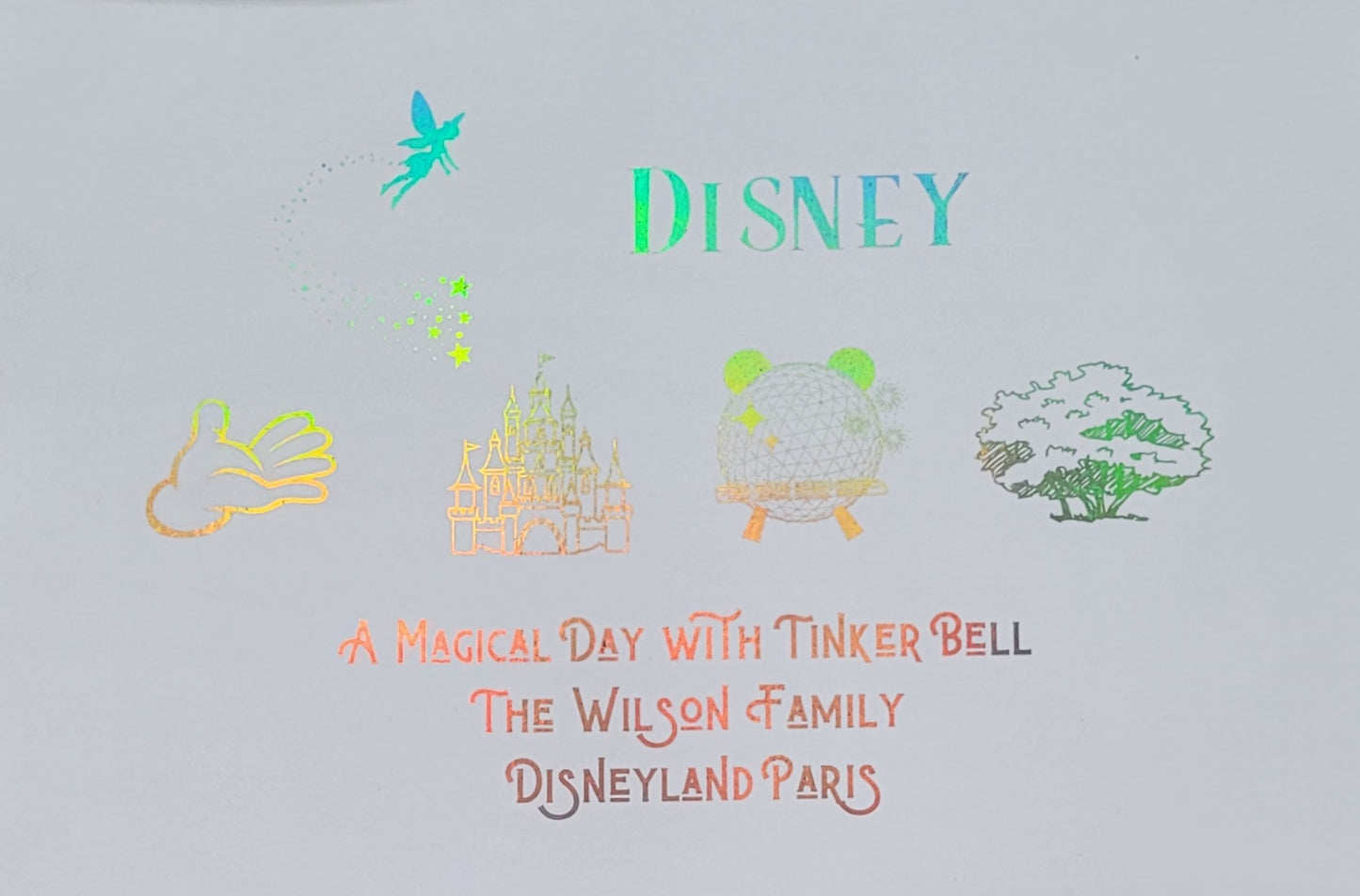 Close-up of rainbow coloured foil Disney-inspired artwork inside black photo frame