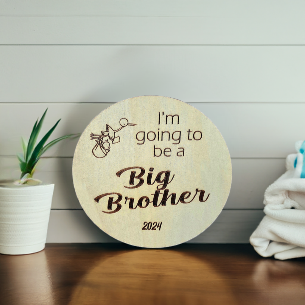 Personalised wooden sibling pregnancy announcement sign engraved with custom name