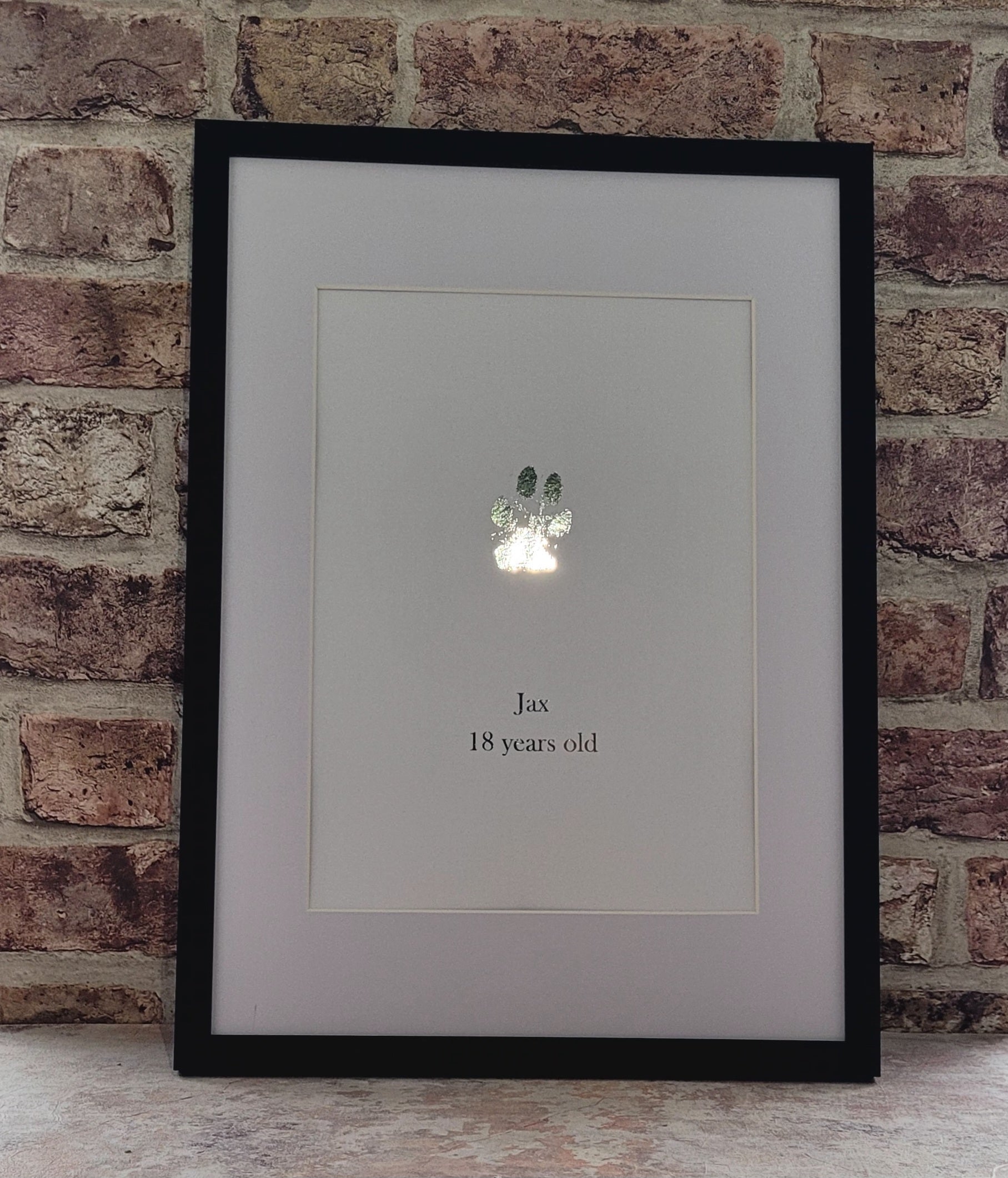 Silver framed paw print