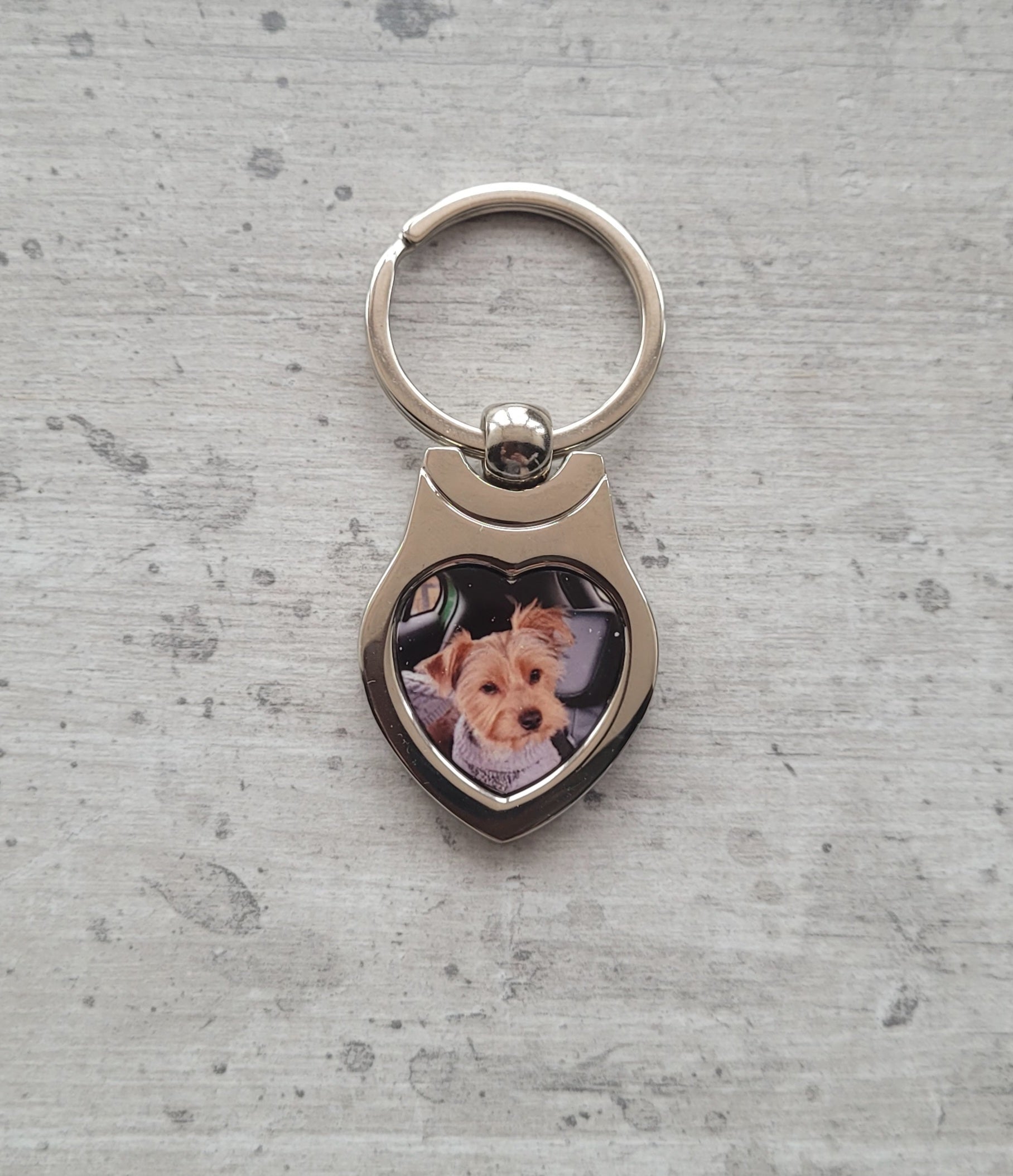 Dog pet photo heart keyring displayed on tabletop