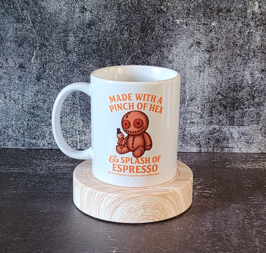 Gothic style mug featuring voodoo doll artwork.