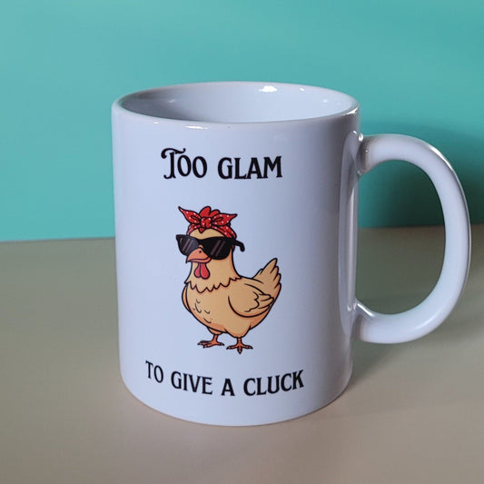 Funny chicken mug with Too Glam to Give a Cluck design on white 11oz ceramic mug.”