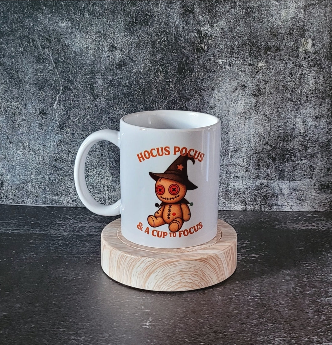 Quirky spooky mug with voodoo doll design and witch quote.