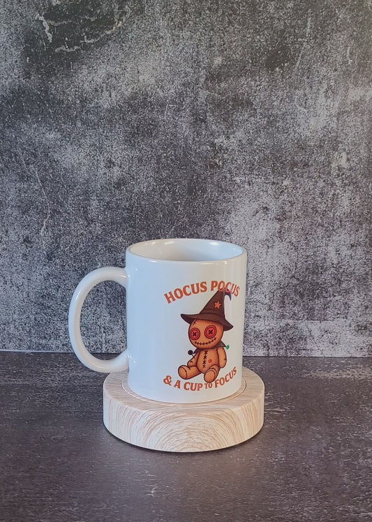 Witch mode funny mug displayed on wooden stand.