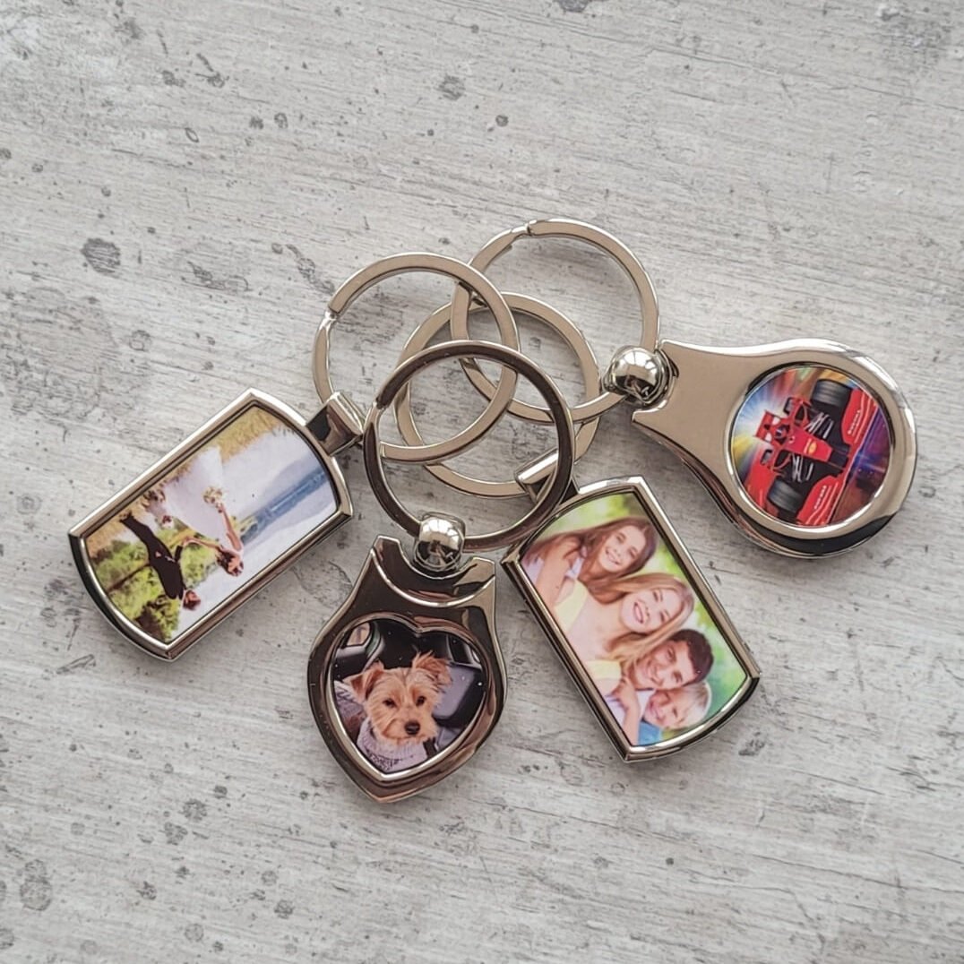 4 different shaped photo keyrings