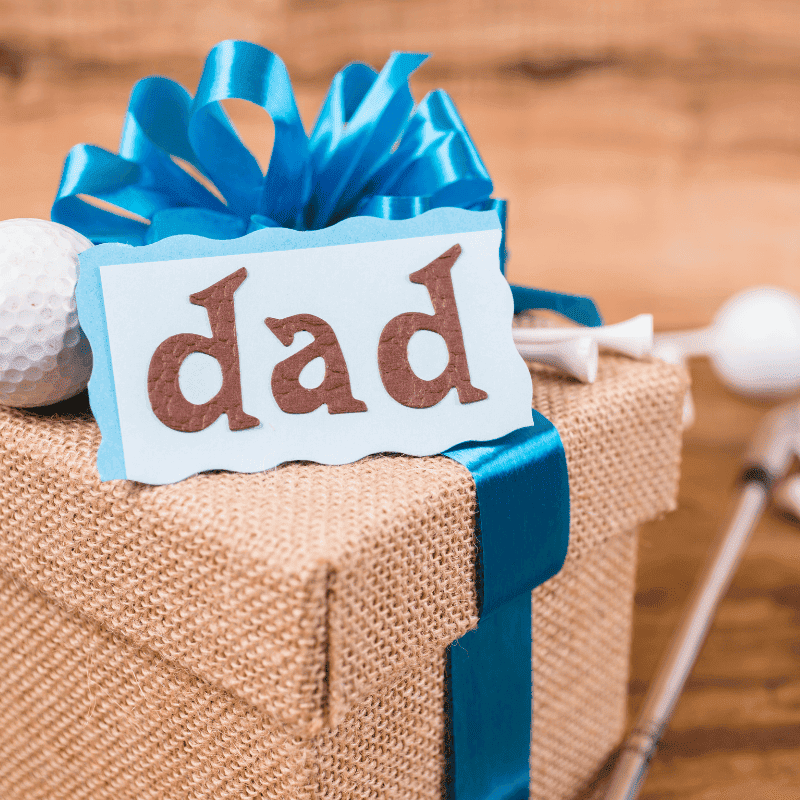 brown gift box with dad tag and blue ribbon