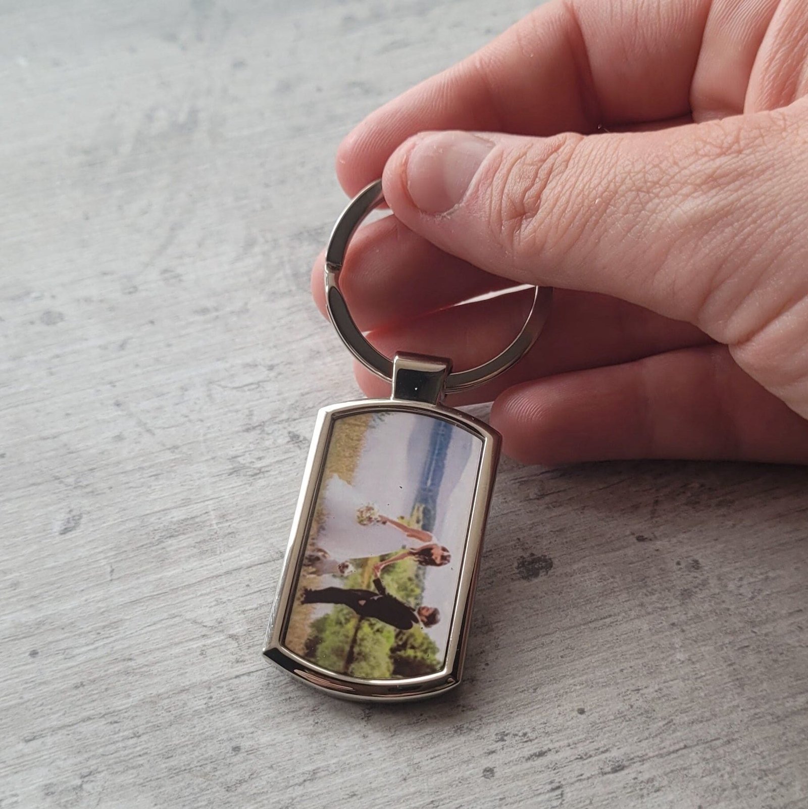 rectangle wedding photo personalised photo keyring in hand