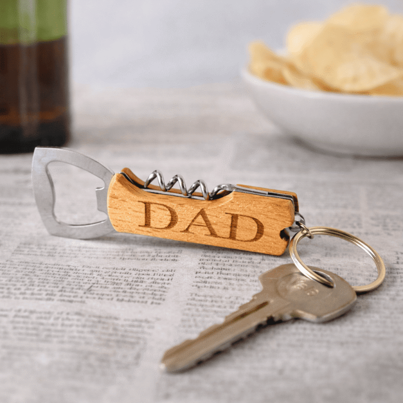 personalised wooden keyring bottle opener with corkscrew engraved with dad text and attached to house keys