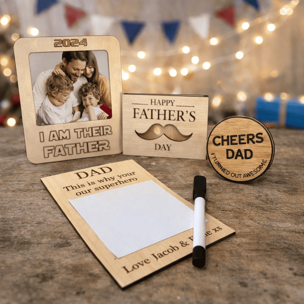 fathers day wooden gift set with a engraved i am their father star wars theme photo frame fridge magnet, wood gift card holder engraved with happy fathers day dad and a moustache shaped opening to see gift card , round cheers dad engraved bottle opener and engraved wipeable board personalised with message and pen. on a blue flag back ground.