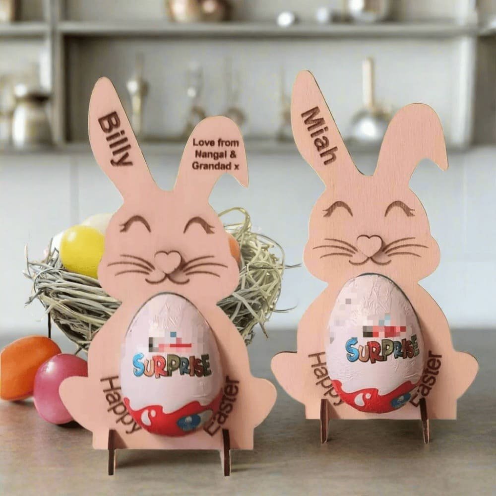 Personalised wooden Easter bunny chocolate egg holders engraved with names, a fun handmade Easter gift for children.