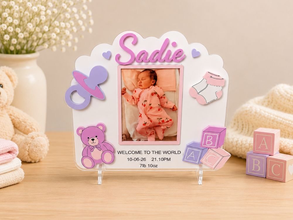 Personalised new baby photo frame featuring the baby's name, photograph and birth details, a handmade keepsake gift to celebrate a new arrival.