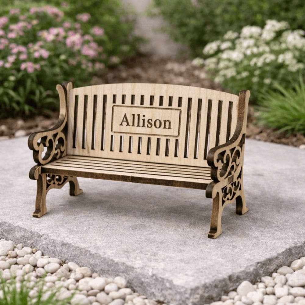 Personalised miniature wooden memorial bench engraved with a name, a thoughtful remembrance keepsake for remembering someone special.
