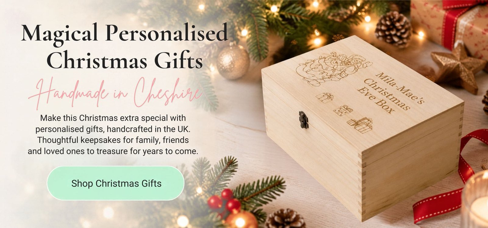 Magical Personalised Christmas Gifts — handmade in Cheshire. Engraved wooden Christmas Eve box personalised with a child's name, surrounded by pine branches, fairy lights and pinecones.